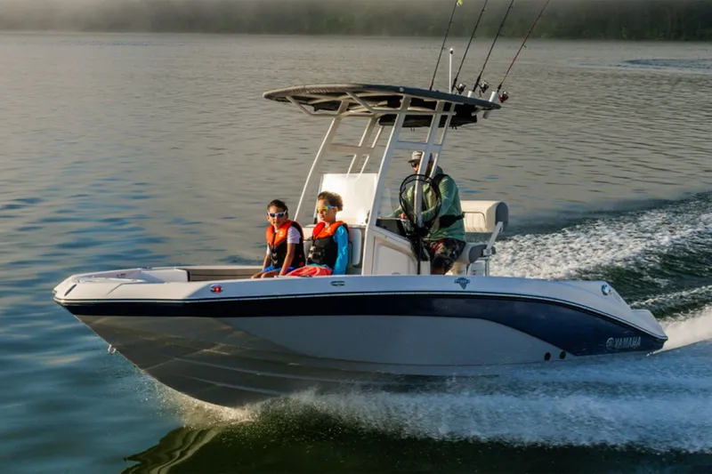 Slide: The Image of Yamaha 195 FSH Sport 2026 on calm water with passengers. - 7