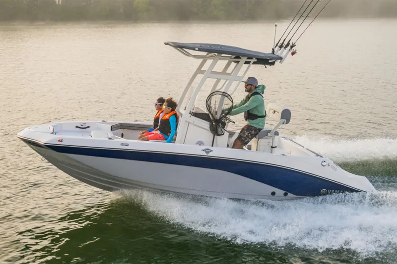 Slide: The Image of 2026 Yamaha Boats 190 FSH Sport on water with three people. - 8