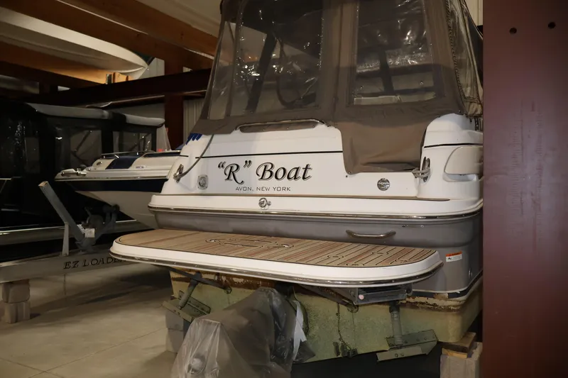 Slide: The Image of 2006 Larson Cabrio 240 boat in storage, featuring "R" Boat from Avon, New York. - 11