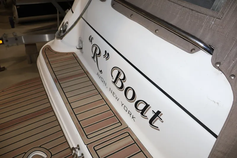 Slide: The Image of 2006 Larson Cabrio 240 boat with "R" Boat name, Avon, New York. - 13