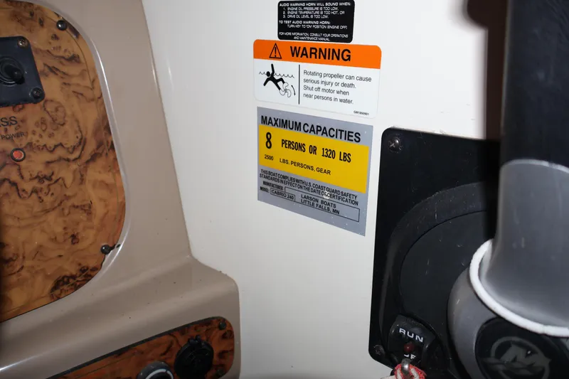 Slide: The Image of 2006 Larson Cabrio 240 boat capacity warning label, maximum 8 persons or 1320 lbs. - 15