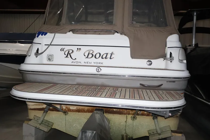 Slide: The Image of 2006 Larson Cabrio 240 boat named "R" Boat, docked in Avon, New York. - 24