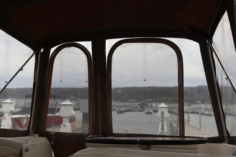 Slide: The Image of Interior view from a 2006 Larson Cabrio 240 boat overlooking a marina. - 31