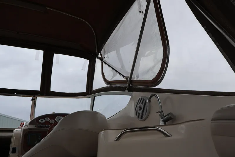 Slide: The Image of Interior view of 2006 Larson Cabrio 240 boat cockpit with dashboard and seating. - 33