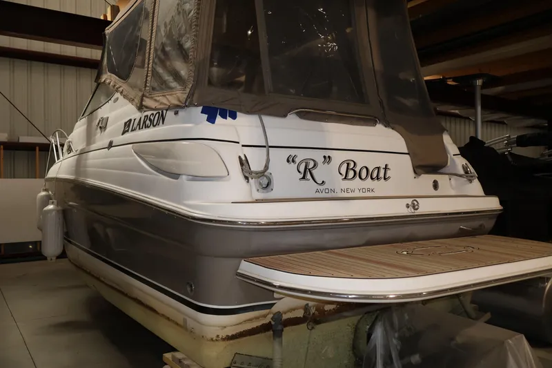 Slide: The Image of 2006 Larson Cabrio 240 boat in storage, labeled "R" Boat, Avon, New York. - 9