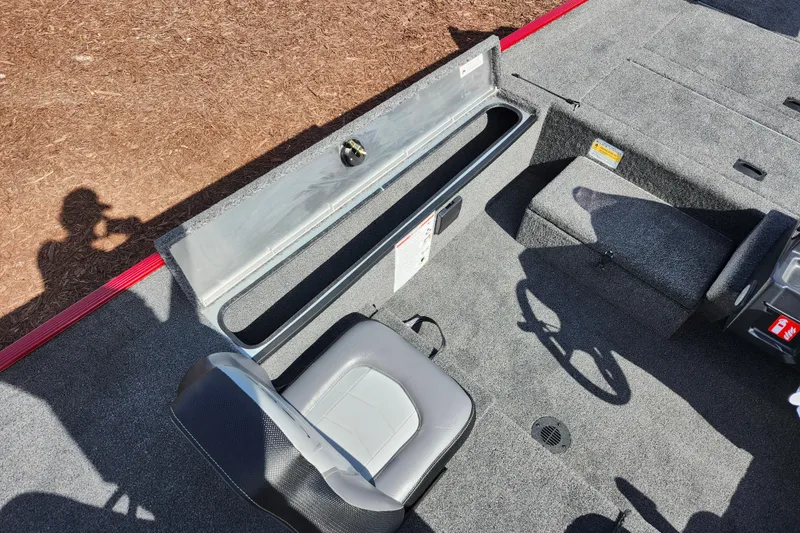 Slide: The Image of Interior view of 2026 Lowe Skorpion 17 boat with seating and storage compartments. - 19