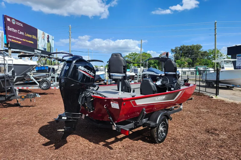 Slide: The Image of 2026 Lowe Skorpion 17 boat with Mercury engine displayed outdoors. - 8