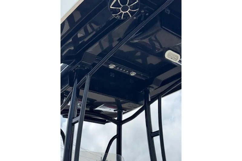 Slide: The Image of 2019 Blue Wave 2400 PureBay boat T-top with speakers and lights, viewed from below. - 10