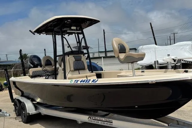 Slide: The Image of 2019 Blue Wave 2400 PureBay boat on trailer, featuring sleek design and comfortable seating. - 20