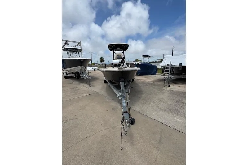 Slide: The Image of 2019 Blue Wave 2400 PureBay boat on trailer under cloudy sky. - 5