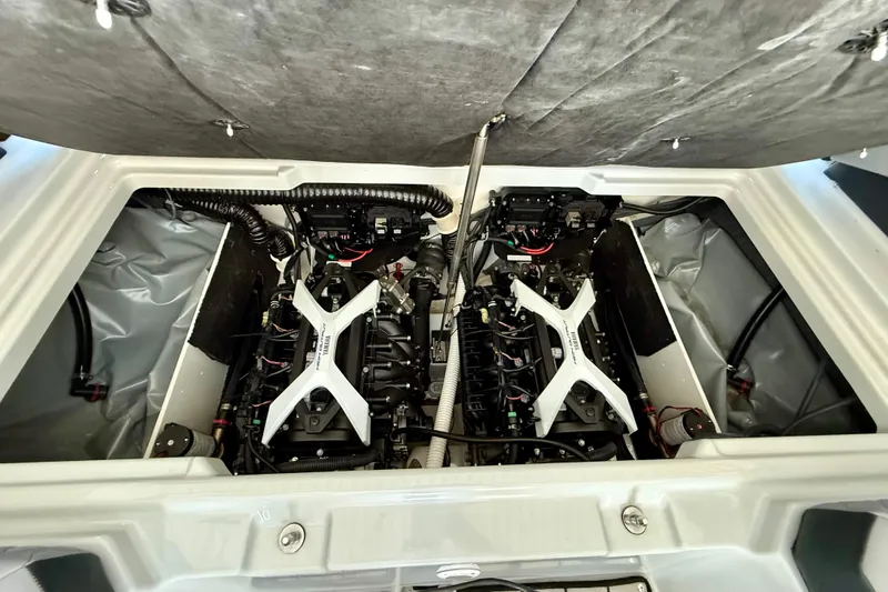Slide: The Image of 2024 Yamaha Boats 222XE engine compartment showcasing dual engines and advanced mechanics. - 16