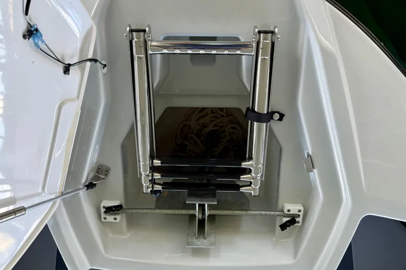 Slide: The Image of 2024 Yamaha Boats 222XE anchor locker with stainless steel ladder. - 22