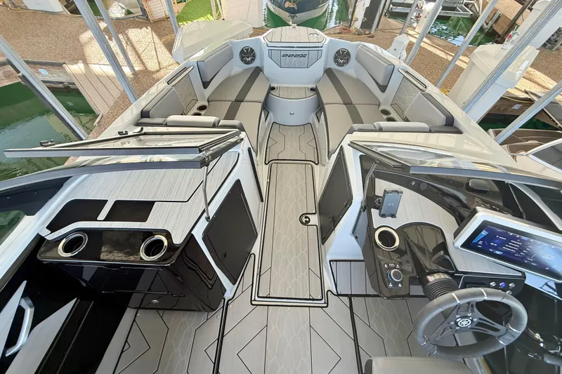 Slide: The Image of 2024 Yamaha Boats 222XE interior, featuring sleek design, modern dashboard, and spacious seating. - 9