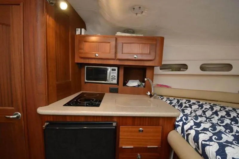 Slide: The Image of 2006 Pro-Line 35 Express cabin interior with kitchenette and bed. - 4