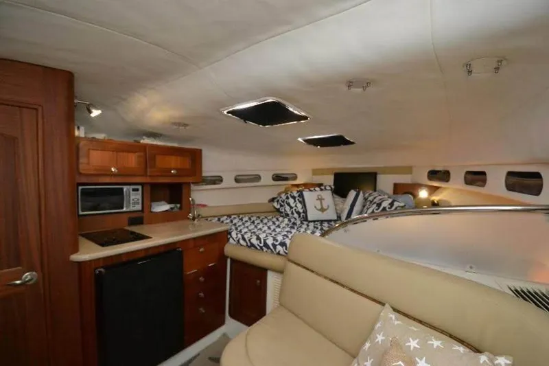 Slide: The Image of 2006 Pro-Line 35 Express cabin interior with kitchenette, bed, and seating area. - 6