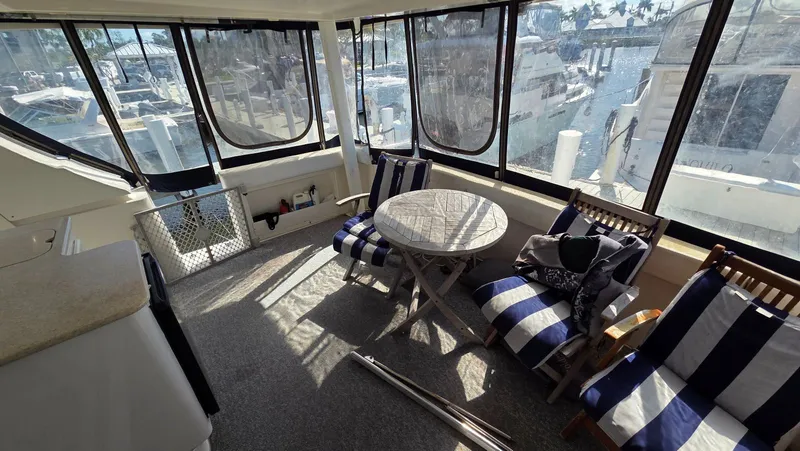 Slide: The Image of Interior of a 2001 Silverton 453 yacht with seating area. - 13
