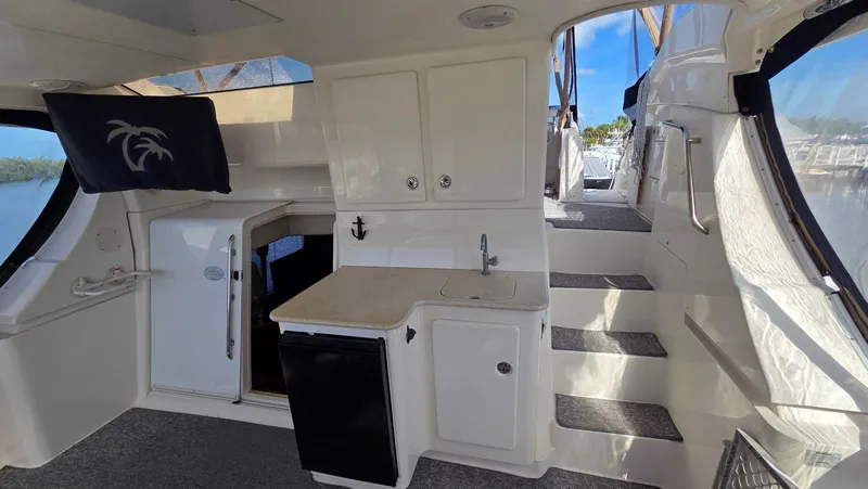 Slide: The Image of Interior of a 2001 Silverton 453 yacht with stairs and minibar. - 15