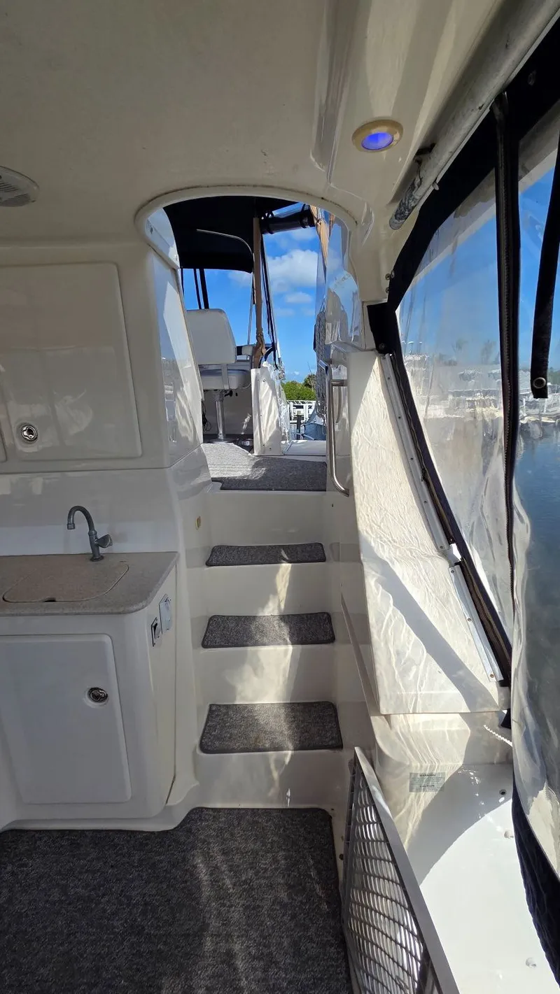 Slide: The Image of Interior view of 2001 Silverton 453 yacht with stairs and window. - 16