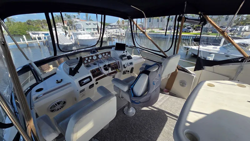 Slide: The Image of Interior view of a 2001 Silverton 453 boat in a marina. - 18