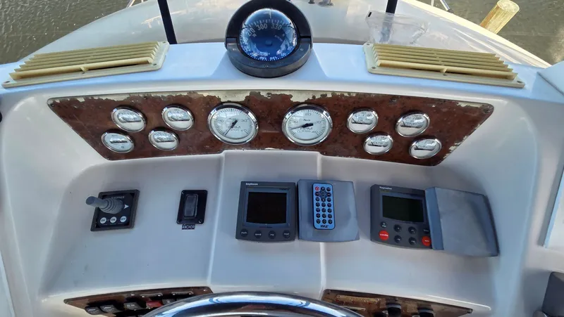 Slide: The Image of Dashboard of a 2001 Silverton 453 with compass and instruments. - 20