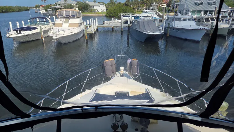 Slide: The Image of View from 2001 Silverton 453 boat overlooking a marina. - 23