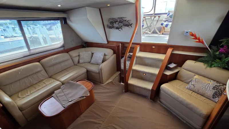 Slide: The Image of Interior of a 2001 Silverton 453 yacht with leather sofas. - 31