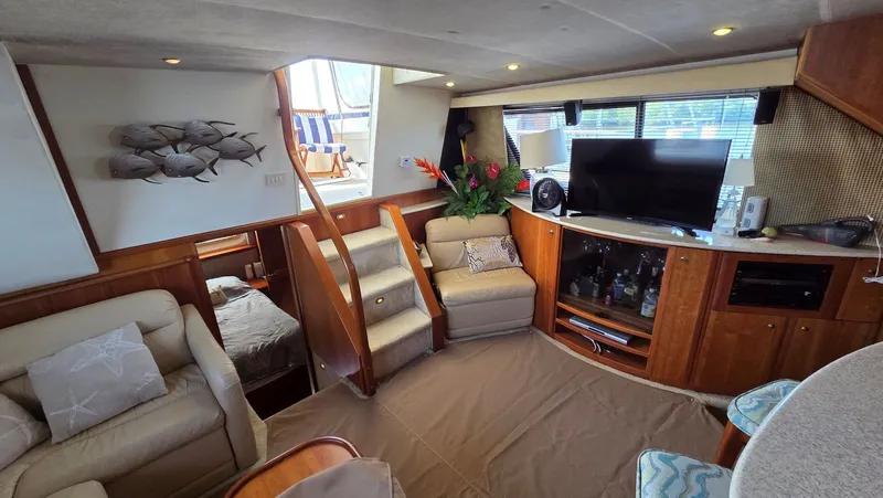 Slide: The Image of Interior of a 2001 Silverton 453 yacht with cozy living area. - 32