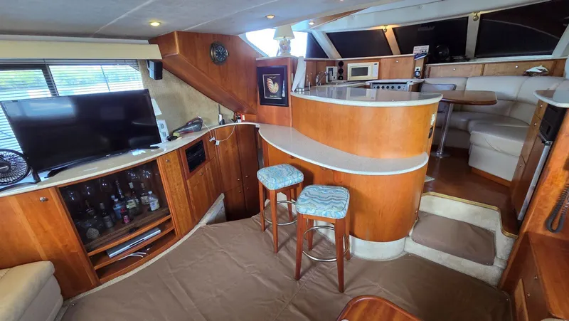 Slide: The Image of Interior of a 2001 Silverton 453 yacht with bar and seating area. - 33