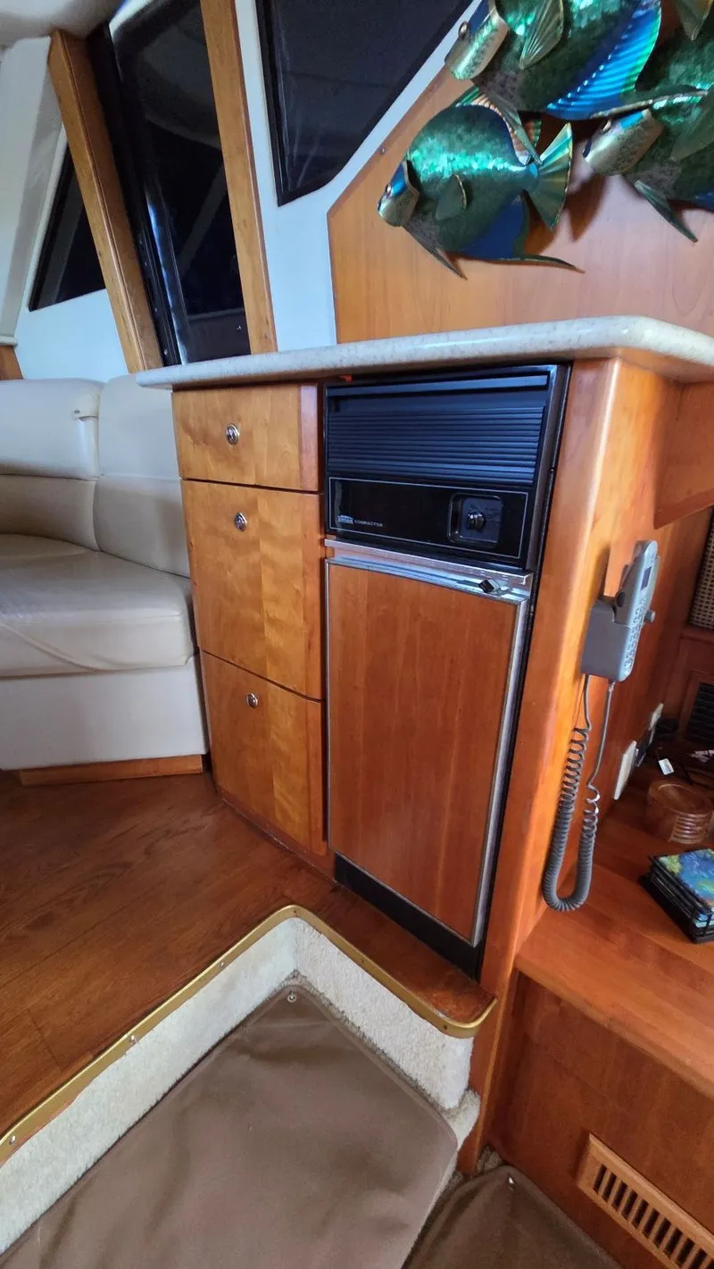 Slide: The Image of Interior of a 2001 Silverton 453 yacht with wooden cabinetry. - 34