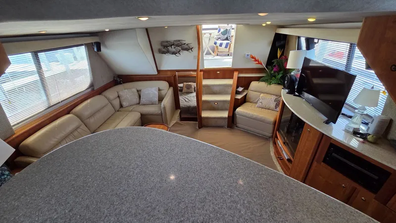 Slide: The Image of Interior of a 2001 Silverton 453 yacht featuring a luxurious living area. - 39