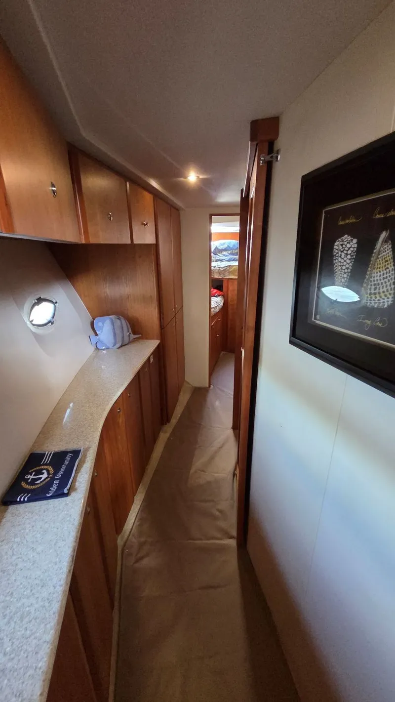 Slide: The Image of Interior of a 2001 Silverton 453 with wooden cabinetry. - 42