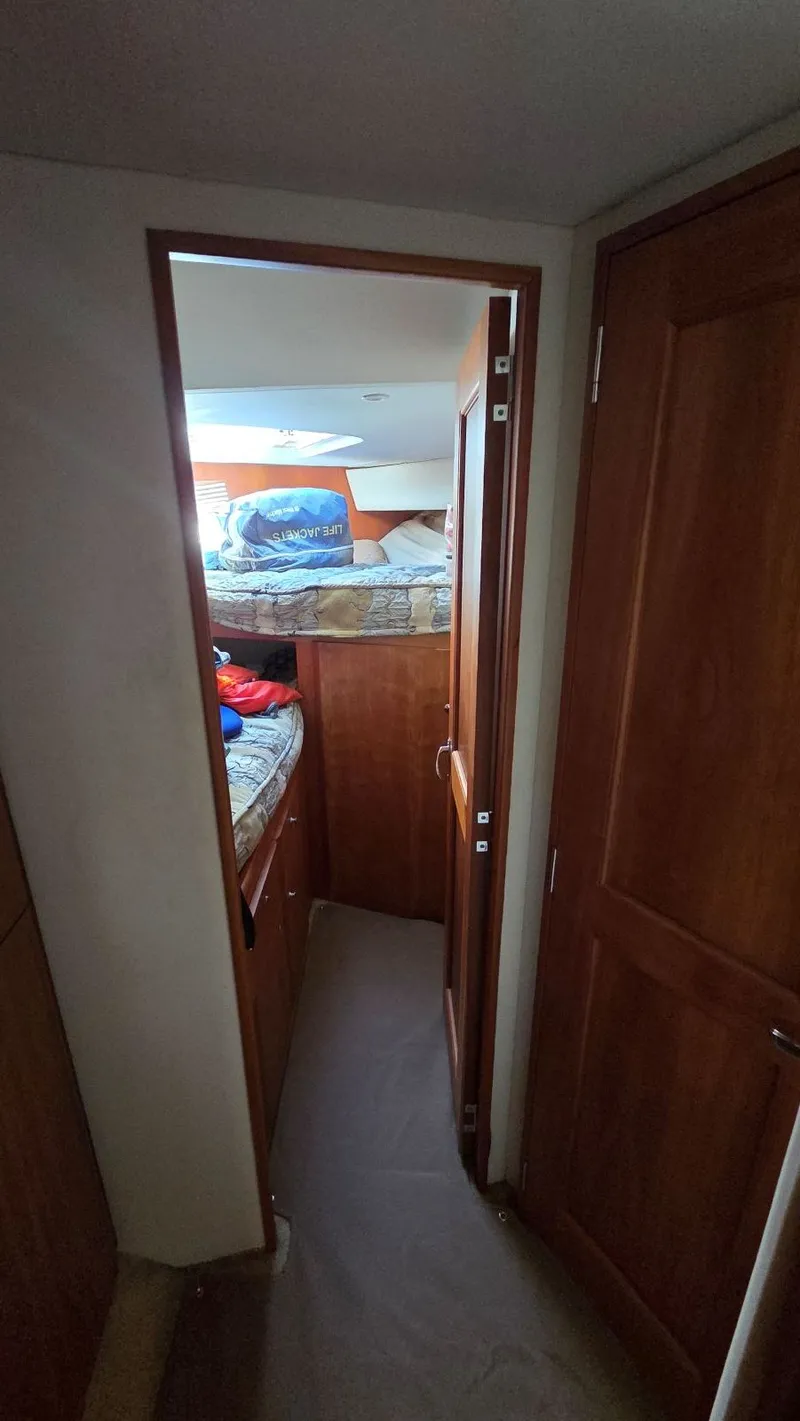 Slide: The Image of Interior of a 2001 Silverton 453 yacht with sleeping area. - 44
