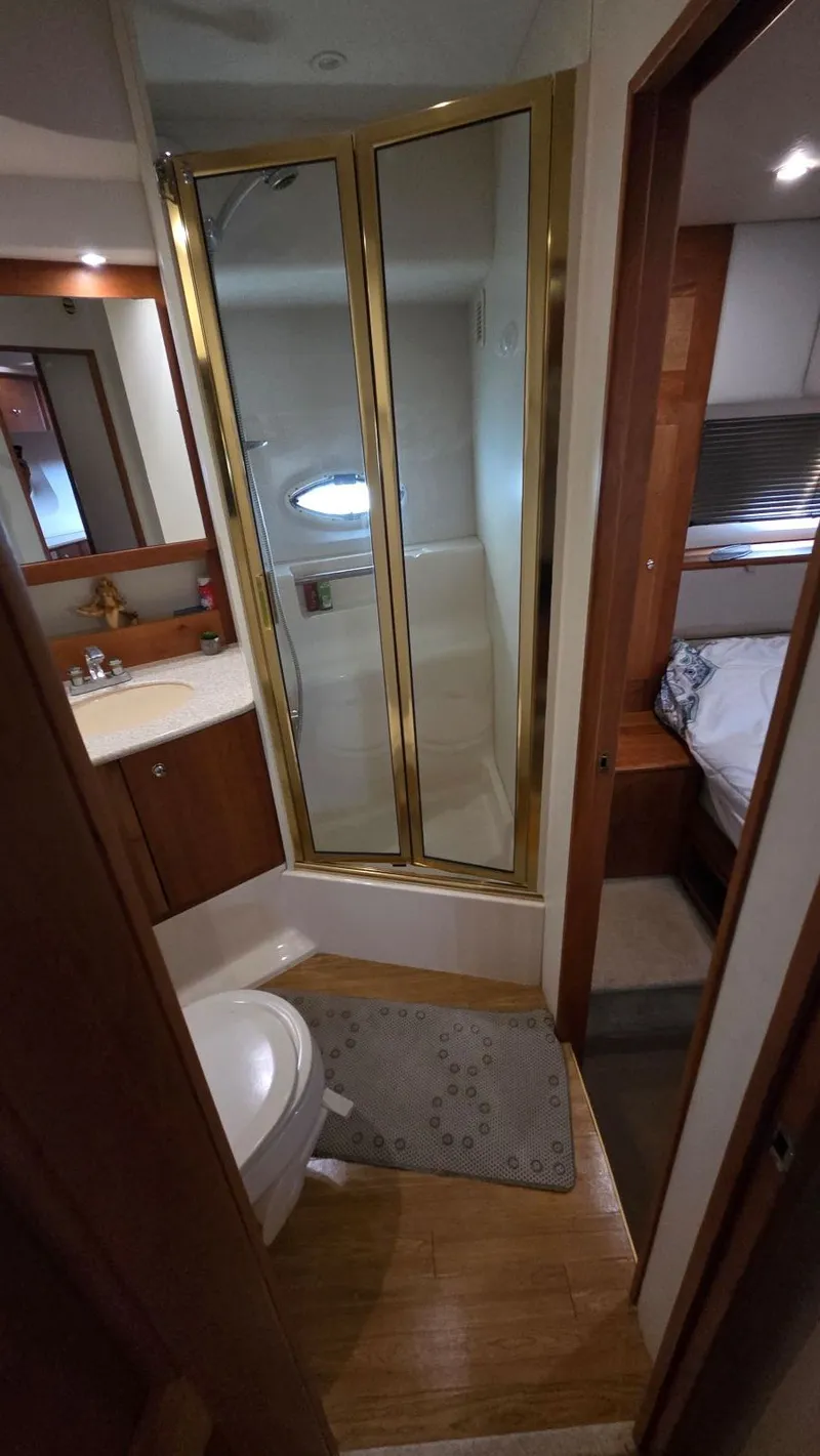 Slide: The Image of Bathroom on a 2001 Silverton 453 yacht with shower and toilet. - 47