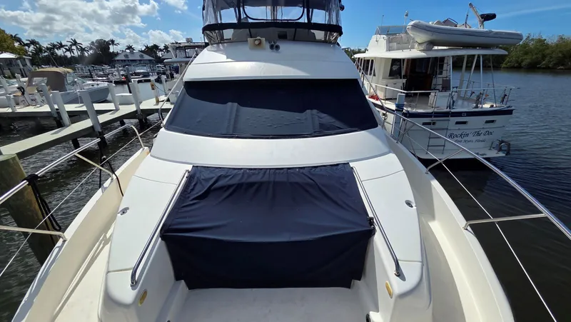 Slide: The Image of 2001 Silverton 453 yacht docked on a sunny day. - 7