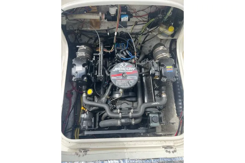 Slide: The Image of Engine compartment of a 2006 Trophy 2359 Hardtop with 5.7L MerCruiser engine. - 16