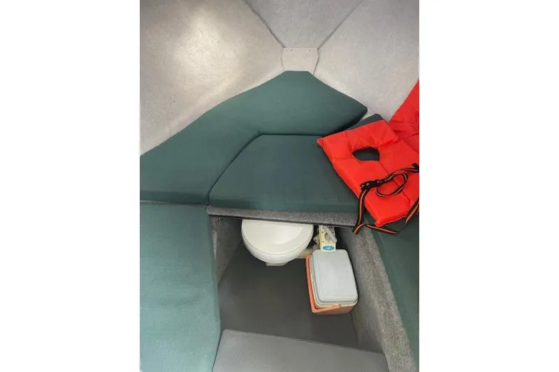 Slide: The Image of Interior cabin of 2006 Trophy 2359 Hardtop boat with seating and life jackets. - 7