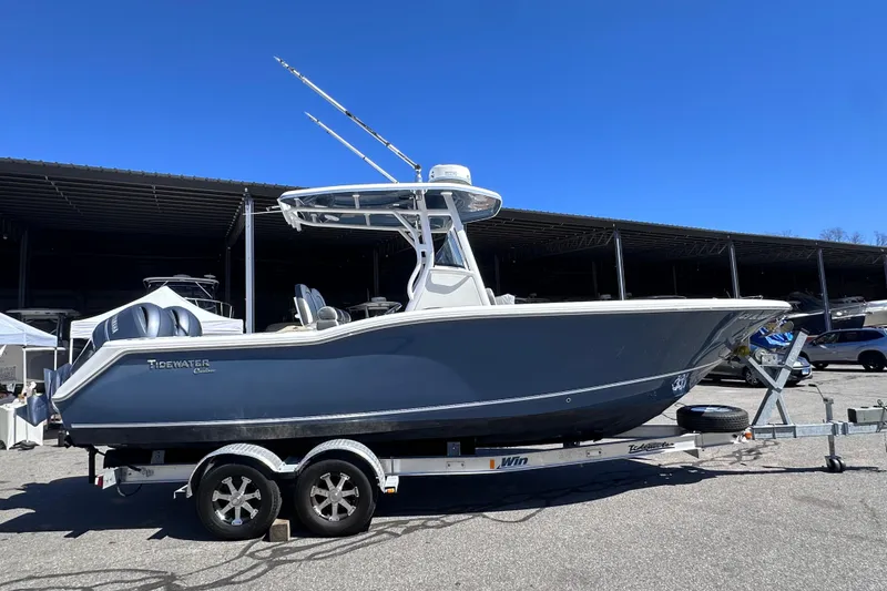 The Image of 2017 Tidewater 252 CC Adventure boat on trailer under clear blue sky. - 0