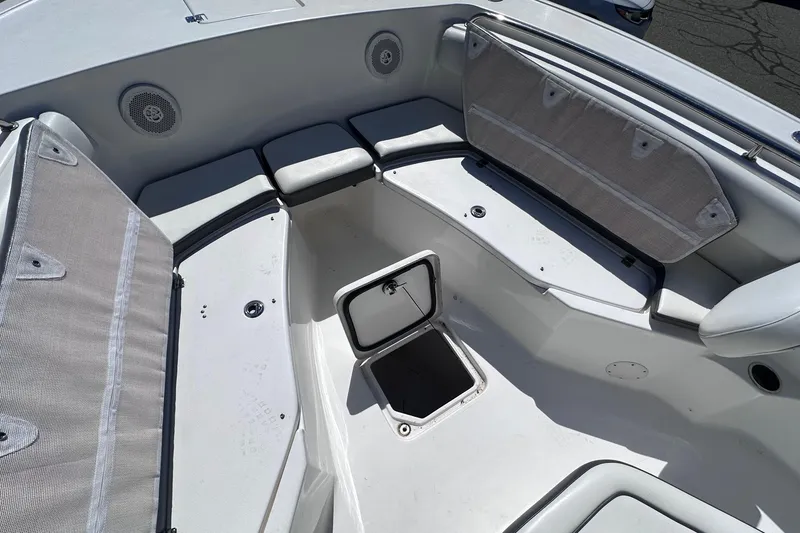 Slide: The Image of 2017 Tidewater 252 CC Adventure boat interior with seating and storage compartments. - 14