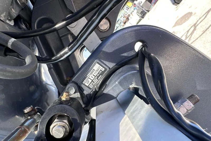 Slide: The Image of Close-up of 2017 Tidewater 252 CC Adventure boat engine components and wiring. - 18