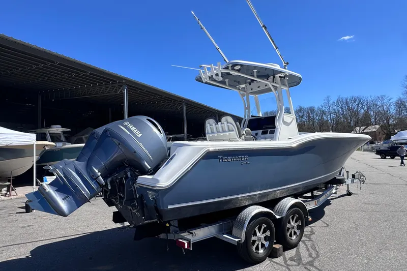 Slide: The Image of 2017 Tidewater 252 CC Adventure boat with Yamaha engine on trailer, parked outdoors. - 3
