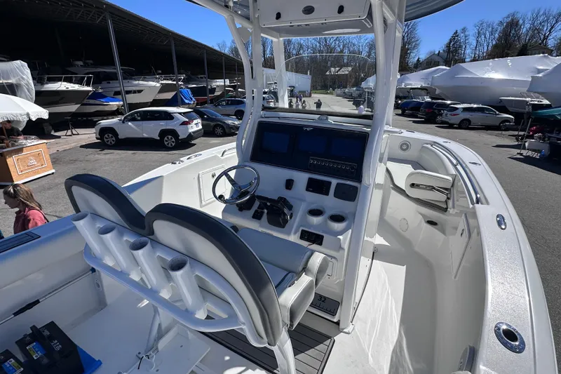 Slide: The Image of 2017 Tidewater 252 CC Adventure boat interior with helm, seats, and control panel. - 9