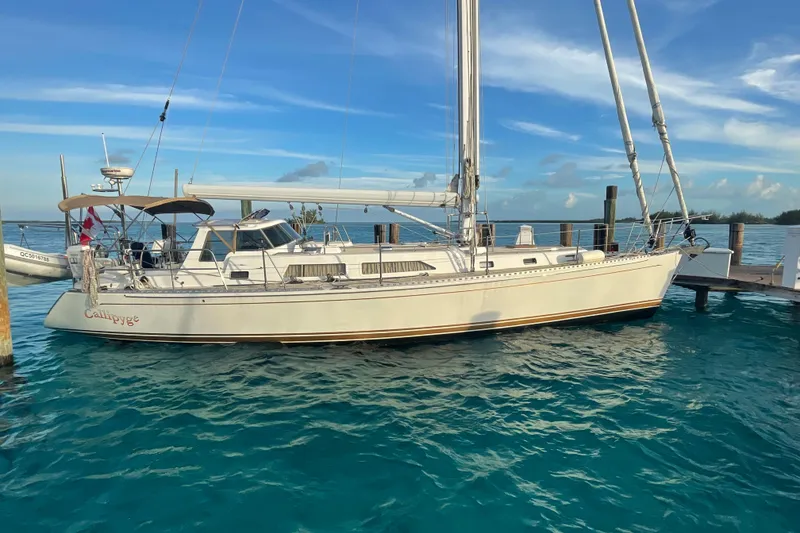 The Image of Sailboat docked in clear blue water, Outbound 46 model, 2015. - 0