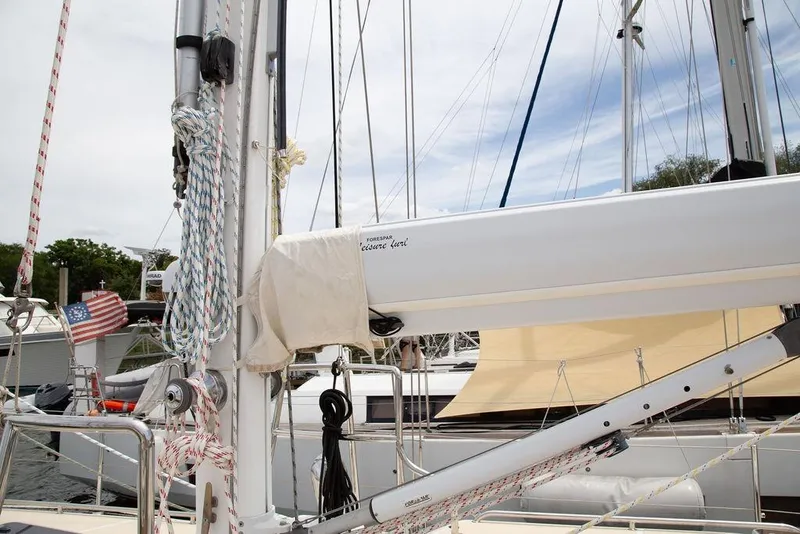 Slide: The Image of Sailboat mast and rigging on a 2015 Outbound 46 yacht in a marina. - 11