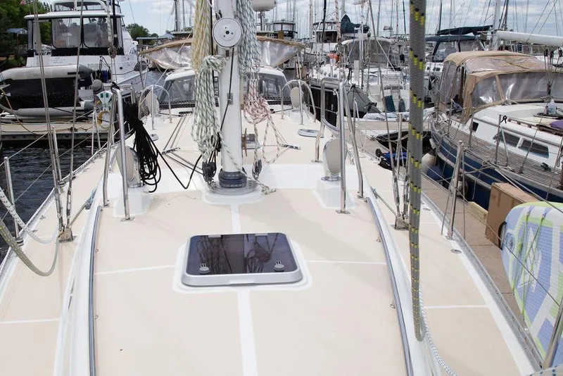 Slide: The Image of Sailboat deck view of 2015 Outbound 46 model docked at marina. - 12