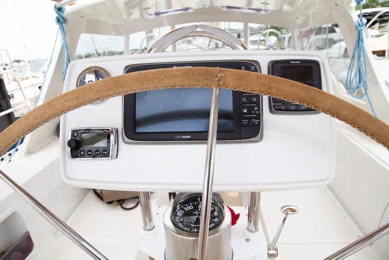 Slide: The Image of Steering wheel and navigation instruments on 2015 Outbound 46 yacht cockpit. - 16