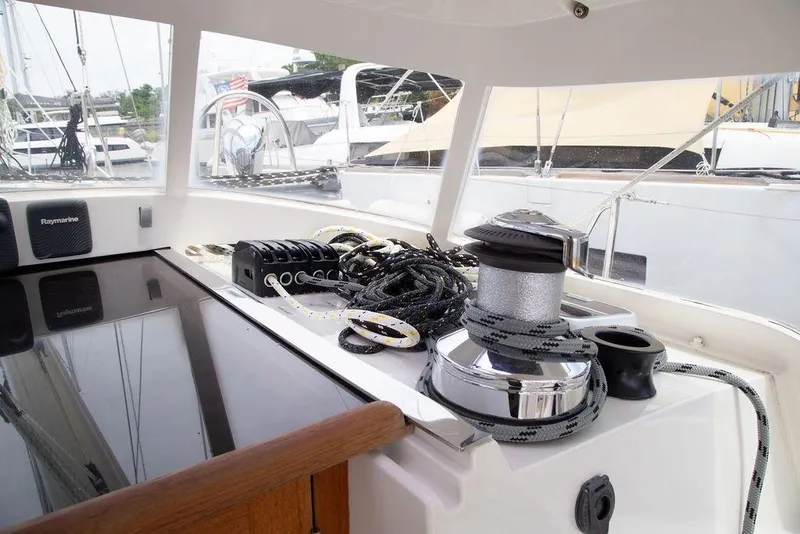 Slide: The Image of Cockpit of 2015 Outbound 46 sailboat with winch, ropes, and navigation equipment. - 20