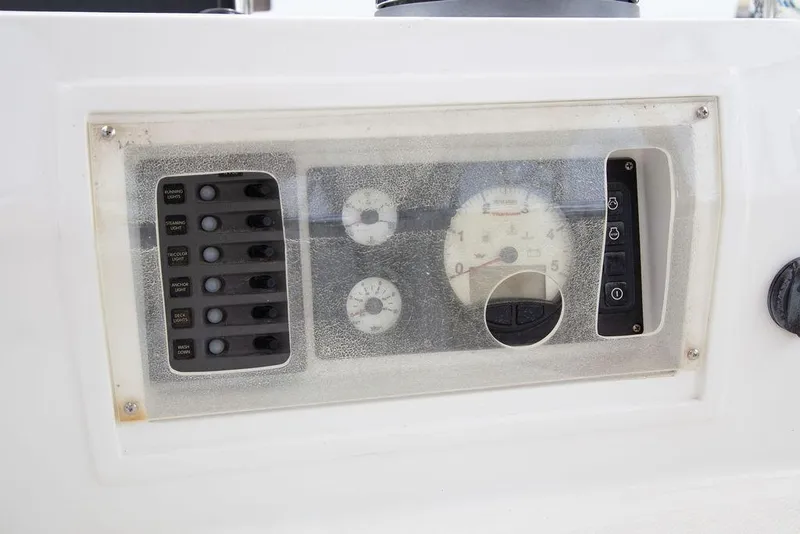 Slide: The Image of Control panel of a 2015 Outbound 46 yacht with gauges and switches. - 25