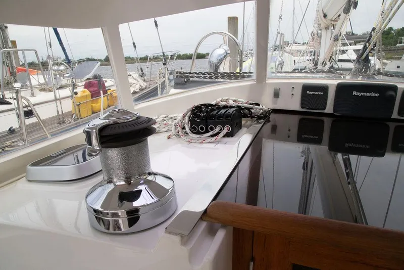 Slide: The Image of Sailing yacht cockpit with winch, ropes, and Raymarine equipment on Outbound 46, 2015 model. - 26