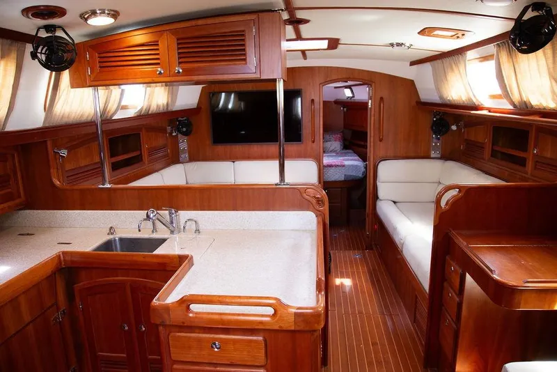 Slide: The Image of Luxurious interior of 2015 Outbound 46 yacht with wood finish and modern amenities. - 30