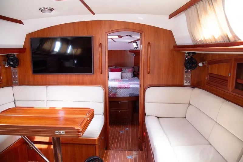 Slide: The Image of Luxurious interior of 2015 Outbound 46 yacht with cozy seating and elegant wood finish. - 31